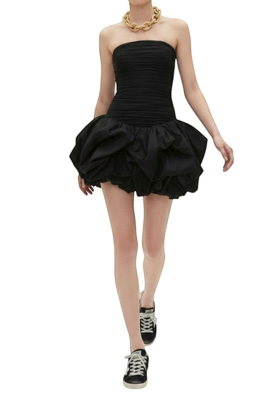 Naked Pear Aje black strapless mini dress with a ruched bodice and voluminous bubble hem worn by a model