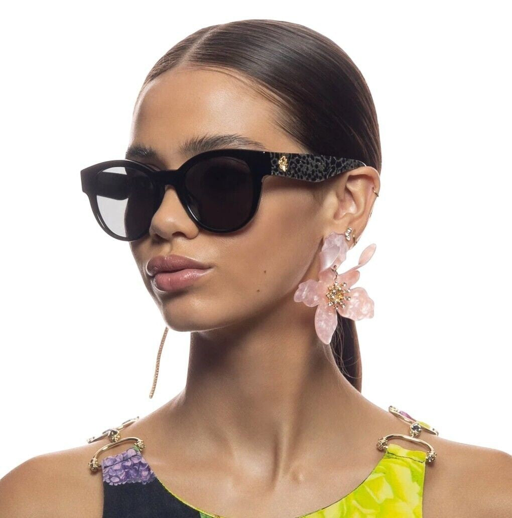 Naked Pear Camilla Sunday in the City round sunglasses in black glitter with leopard print temples on a model