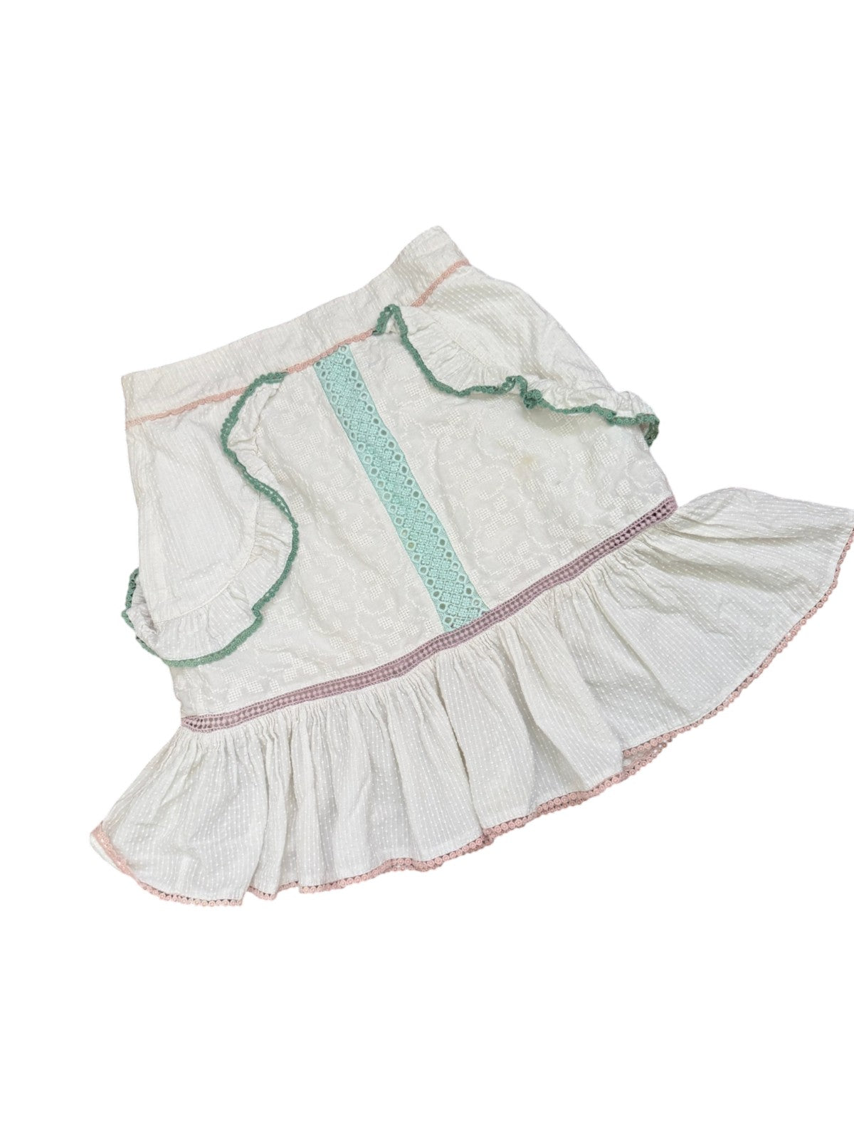Naked Pear Tigerlily Namita white cotton mini skirt with textured fabric, mint green embroidery, and frilled trim.