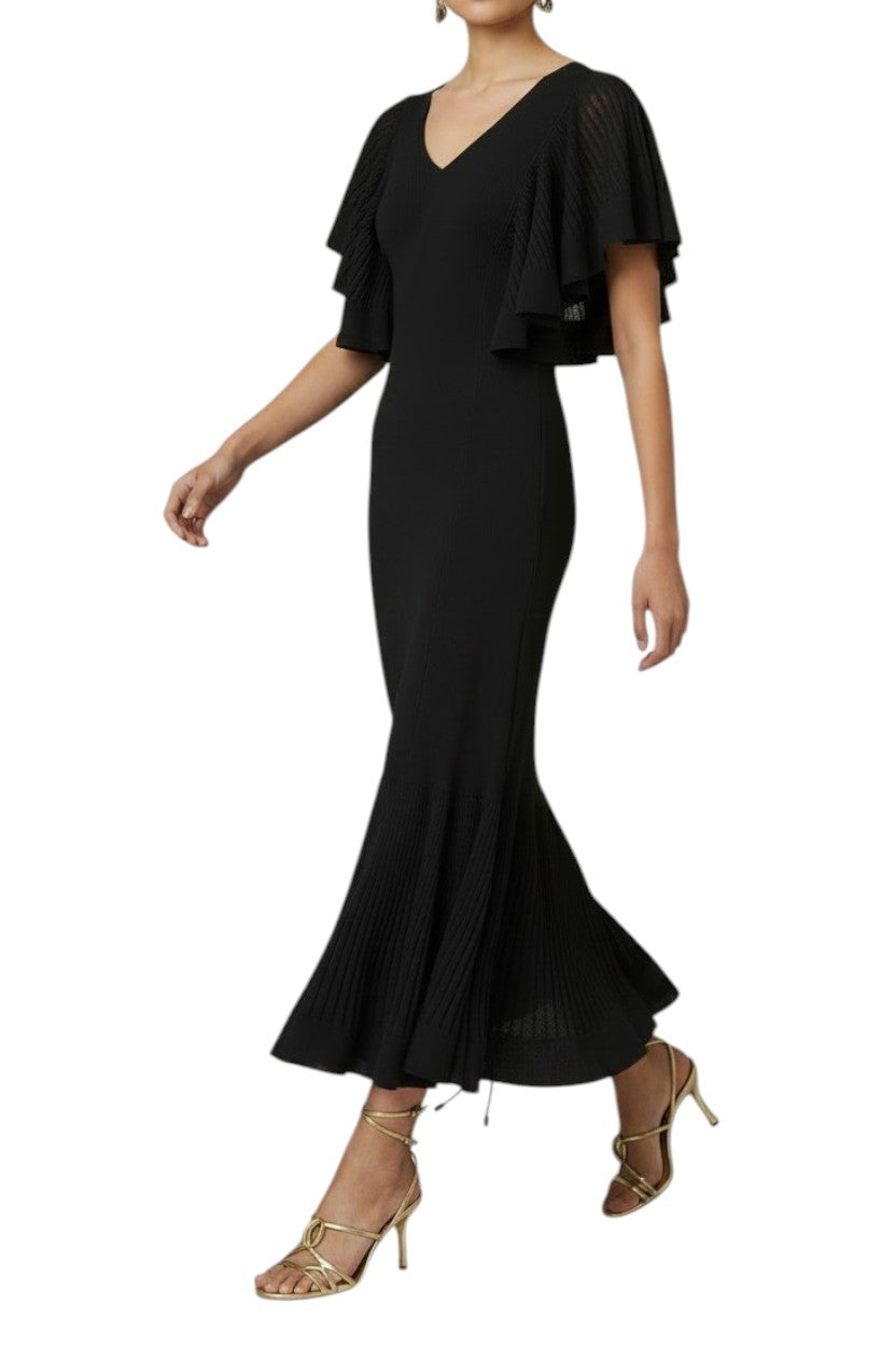 Model wearing a black Zimmermann pleated knit midi dress with flutter sleeves and V-neckline from Naked Pear