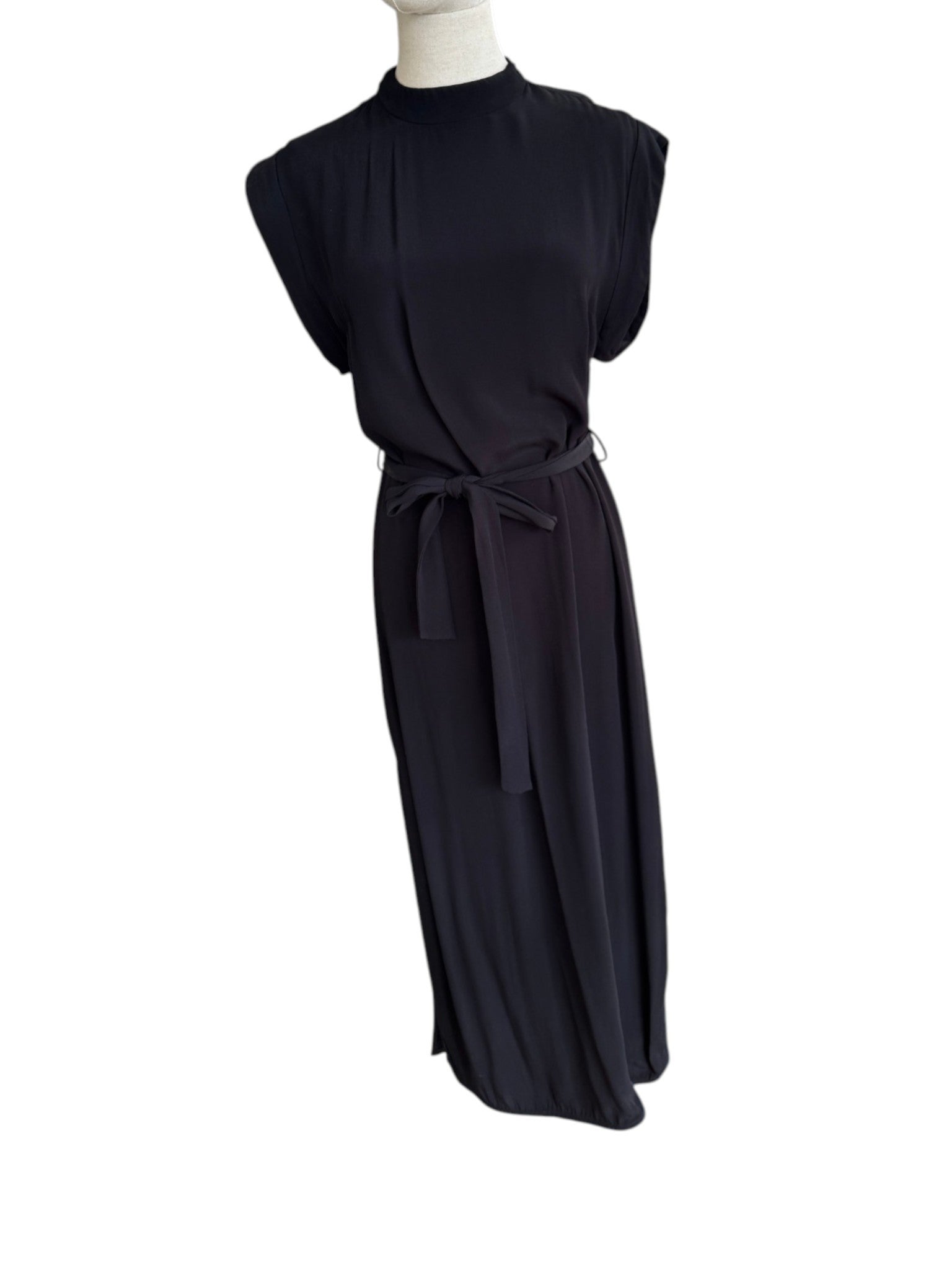 Black dress on a mannequin against a white background