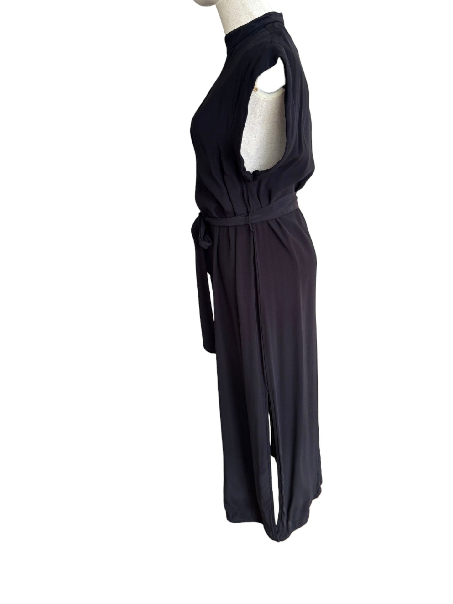 Black dress on a mannequin against a white background