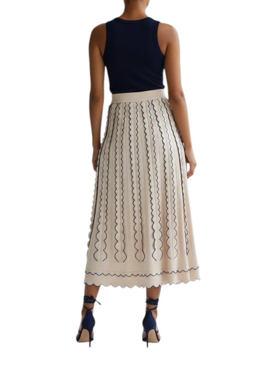 Back view of Naked Pear Zimmermann Wonderland cream and blue knit midi skirt with cutout details and high waist