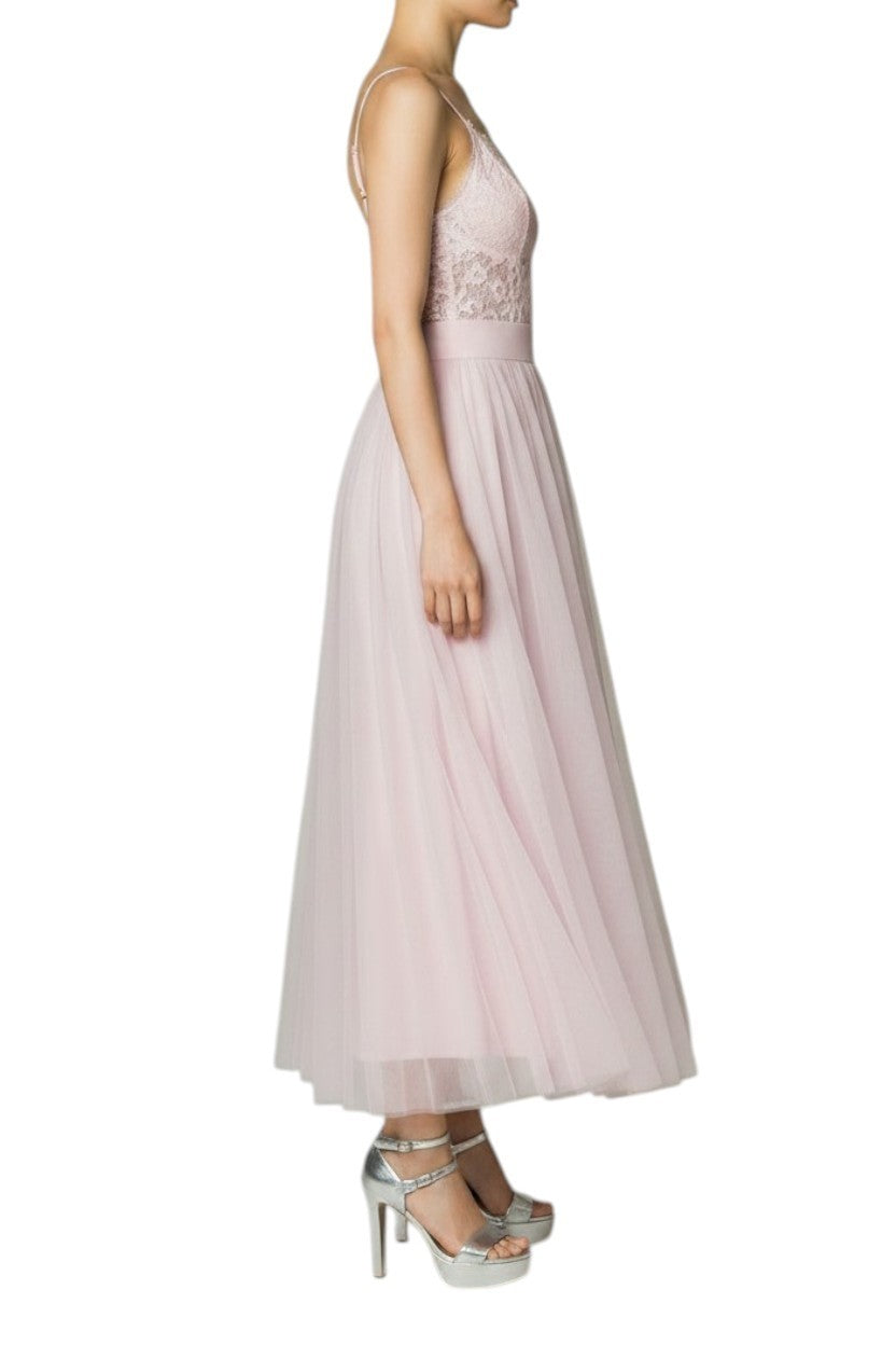 Naked Pear Zimmermann lilac tulle maxi skirt with high waist and gathered layers worn by a model in silver heels