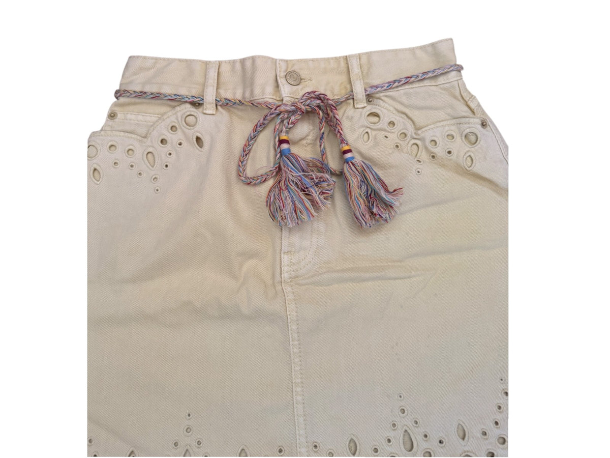 Naked Pear Zimmermann yellow cotton denim mini skirt with scalloped hem, cut-out embroidery, and tassel tie belt.