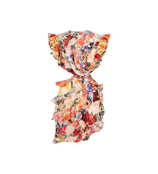 A ruffled sleeveless top with a dense multicolor floral print, featuring shades of red, orange, yellow, pink, and blue on a light cream base, shown against a plain white background.